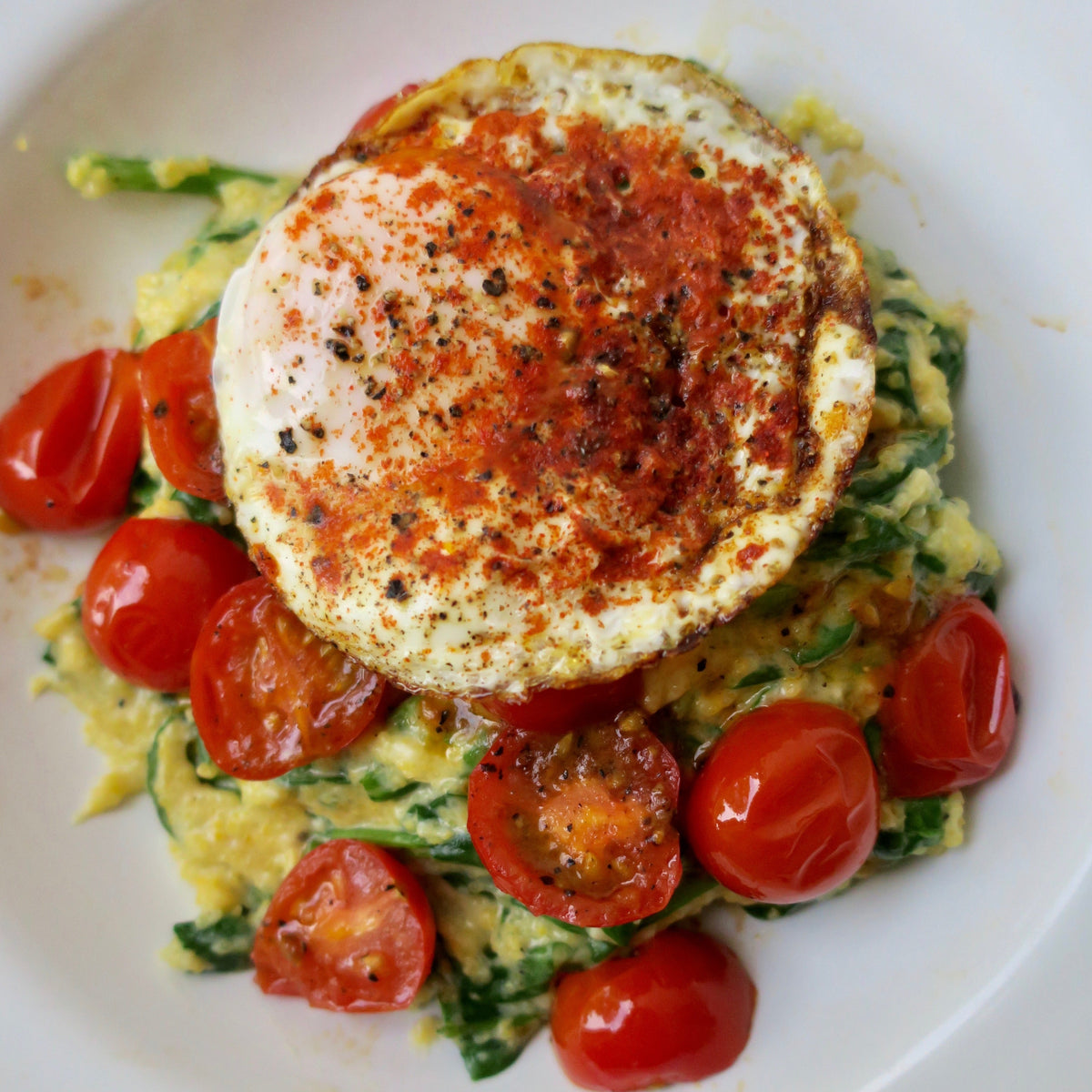 Breakfast Grits Bowl with Tomato, Spinach, & Fried Egg